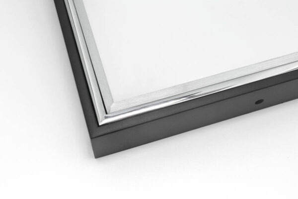 Close up image of SmallCorp TIG1 welded aluminum frame corner sample in black, polished, and brushed