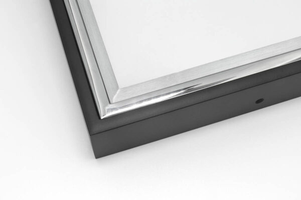 Close up image of SmallCorp TIG2 welded aluminum frame corner sample in black, polished, and brushed