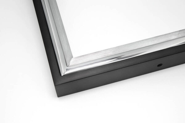 Close up image of SmallCorp TIG3 welded aluminum frame corner sample in black, polished, and brushed