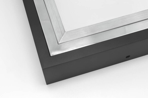 Close up image of SmallCorp TIG6 welded aluminum frame corner sample in black, polished, and brushed