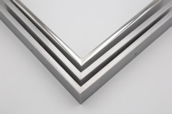 TIG welded aluminum picture frame corner samples in polished, brushed, and black