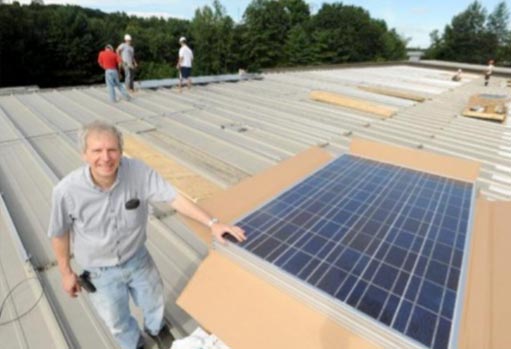 Founder Van on roof with Solar panels being installed